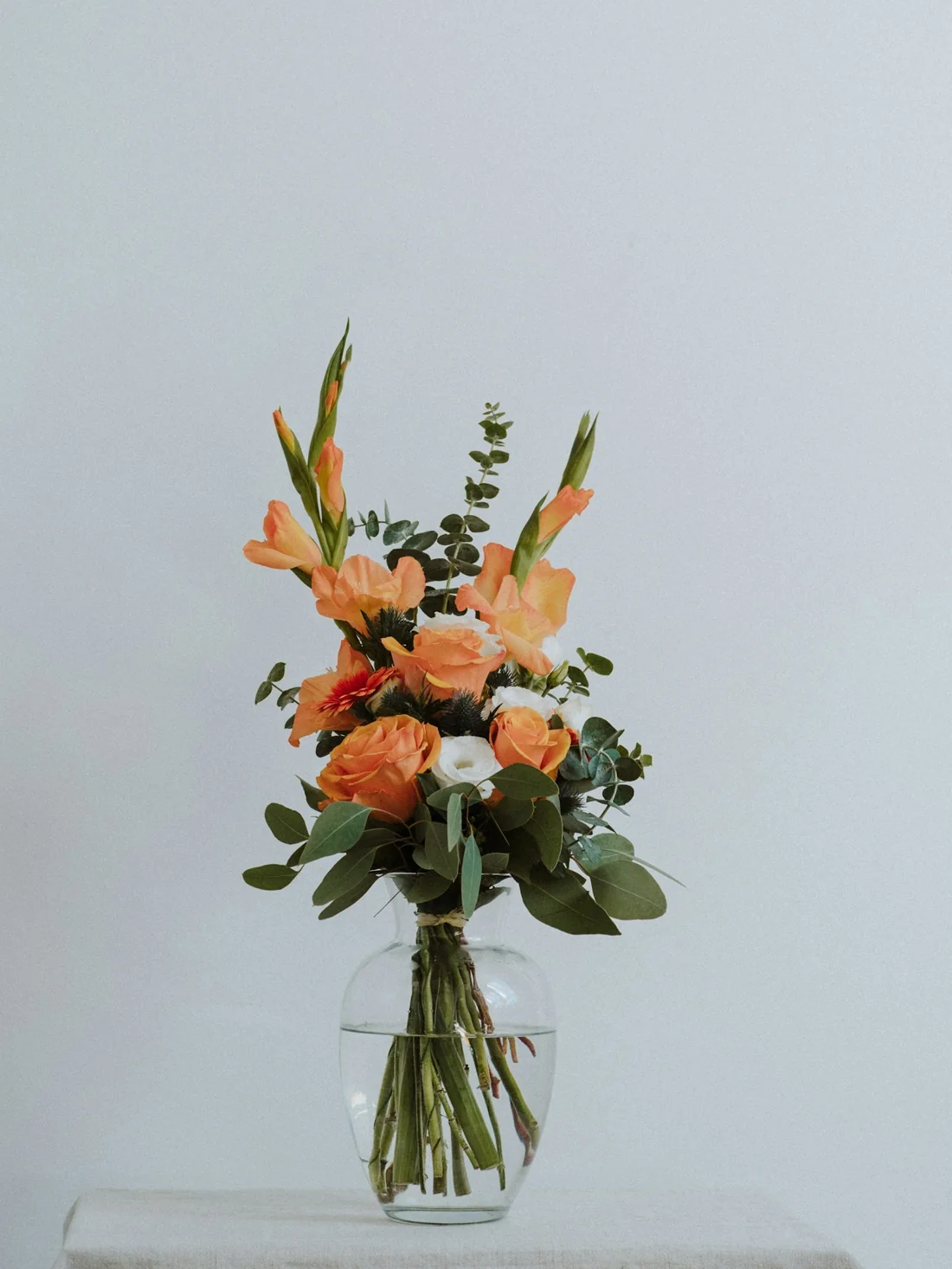 An artful arrangement of orange and white flowers